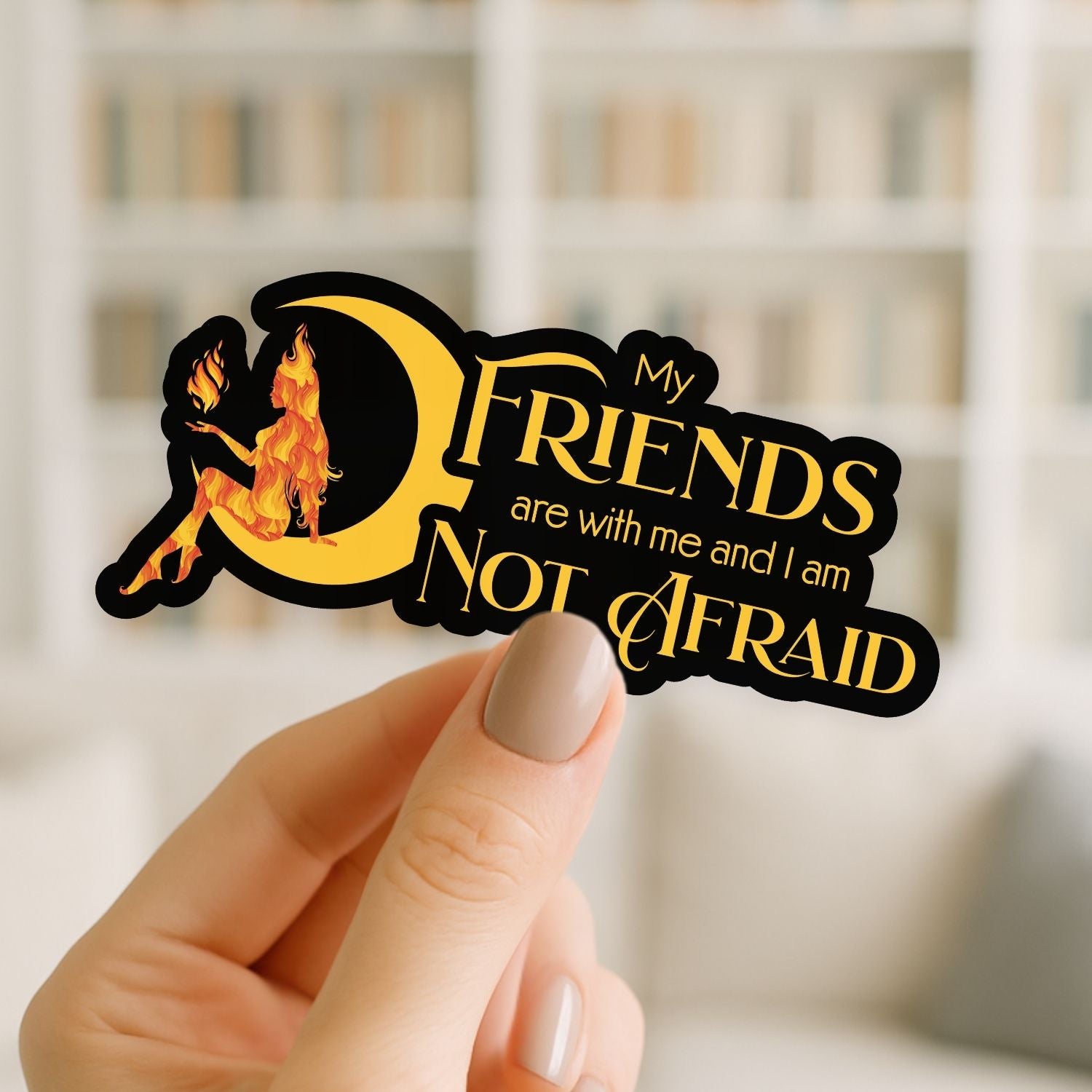 Sticker with 'My friends are with me and I am not afraid' text held by a hand.