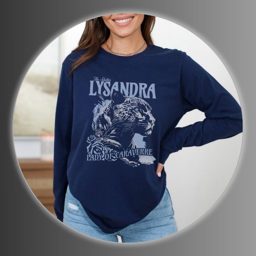 Girl wearing a navy blue sweatshirt with 'LYSANDRA' and a graphic design
