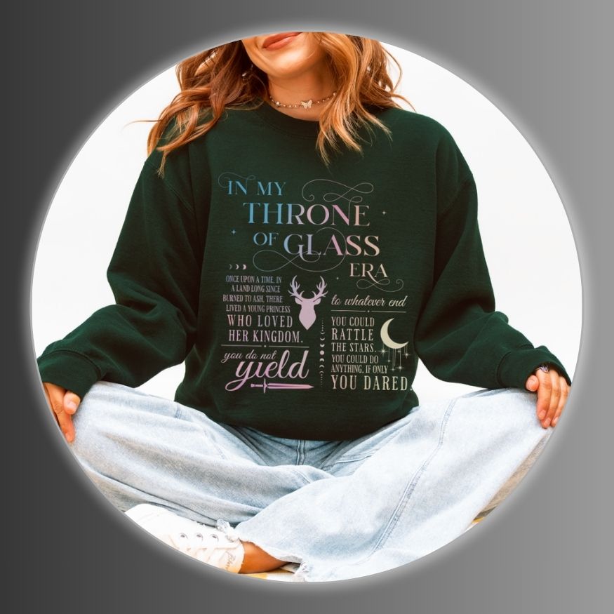 Girl wearing a dark green sweatshirt with text and graphics.
