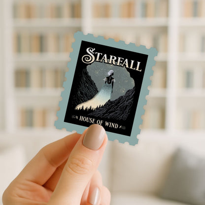 Hand holding a 'Stareall: House of Wind' album cover with a blurred background